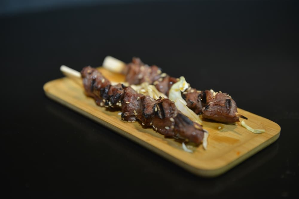 Grilled beef skewers at Taro Japanese Restaurant in Houston, featuring juicy, tender meat and authentic Japanese seasonings
