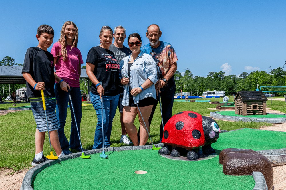 Families enjoying a festive holiday getaway at The Retreat RV & Camping Resort on Lake Houston, participating in Winter Wonderland activities, Christmas events, and outdoor recreation near Houston.