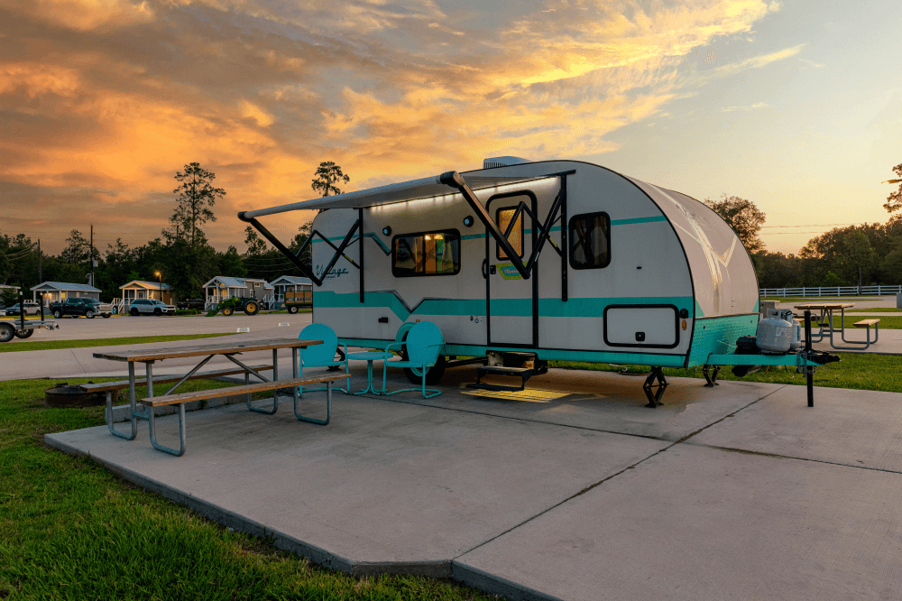 “Scenic view of The Retreat RV & Camping Resort’s decorated cabins and RV sites during the holiday season, showcasing Christmas lights, family-friendly amenities, and Lake Houston’s top winter vacation destination.”