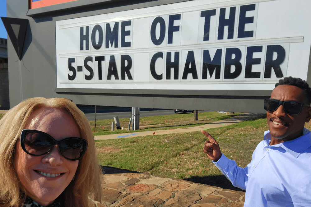 Bastrop Chamber of Commerce five-star accreditation celebration with local business leaders.
