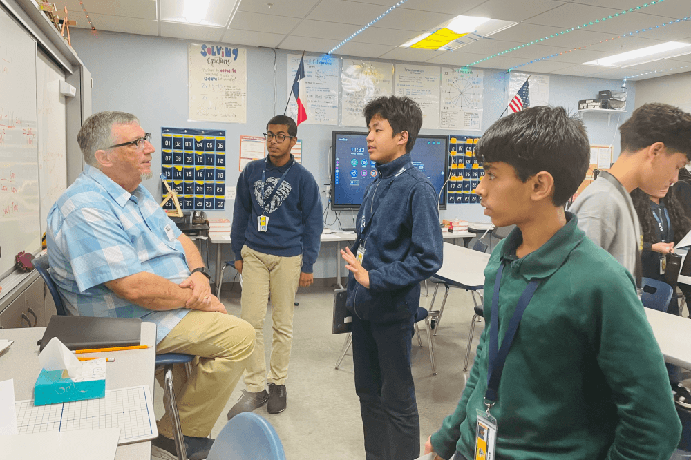 Students asking questions at LPS