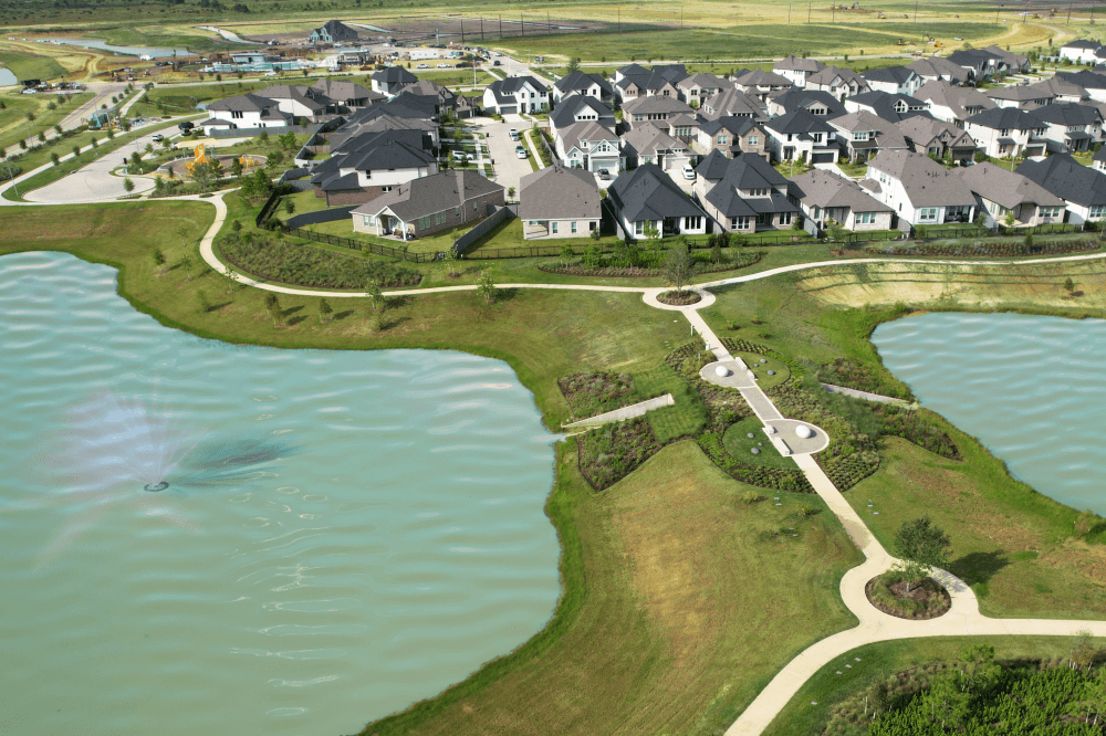 WELL-certified homes at Jubilee wellness master-planned community in Hockley Texas featuring modern healthy home design and outdoor lifestyle amenities.