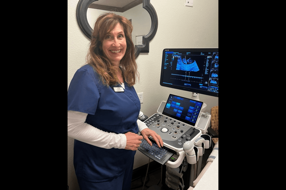woman performing a sonogram