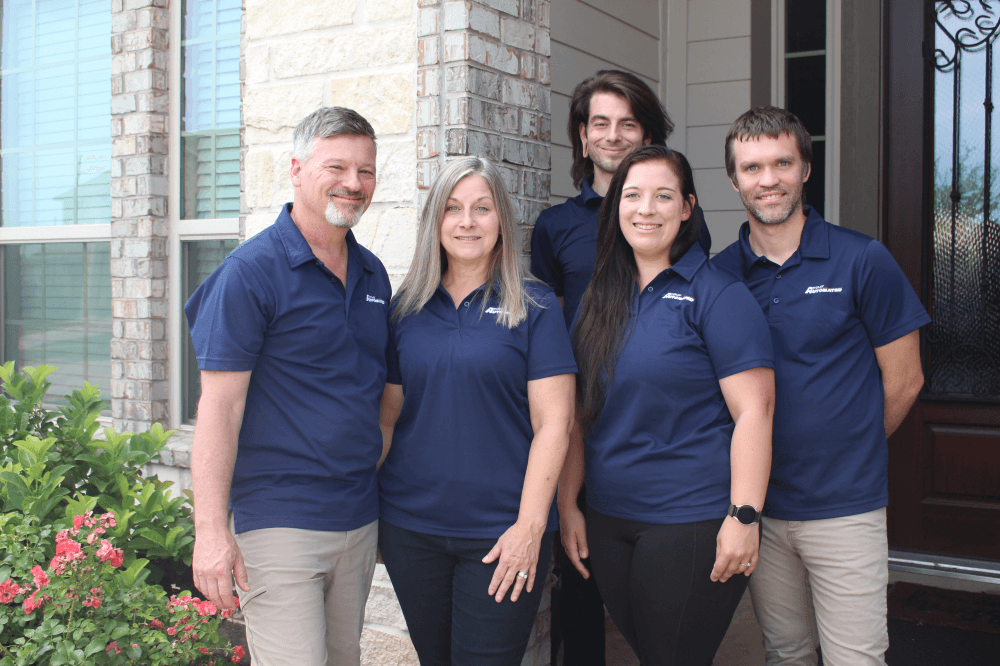 Homeowner using smart home automation system in Houston to control lighting, temperature, and security from one device