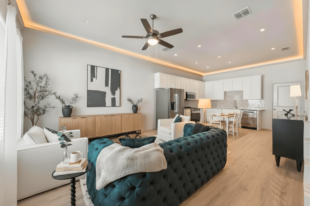Interior of a luxury rental home at West End Estates in New Braunfels with open-concept layout, granite countertops and stainless steel appliances