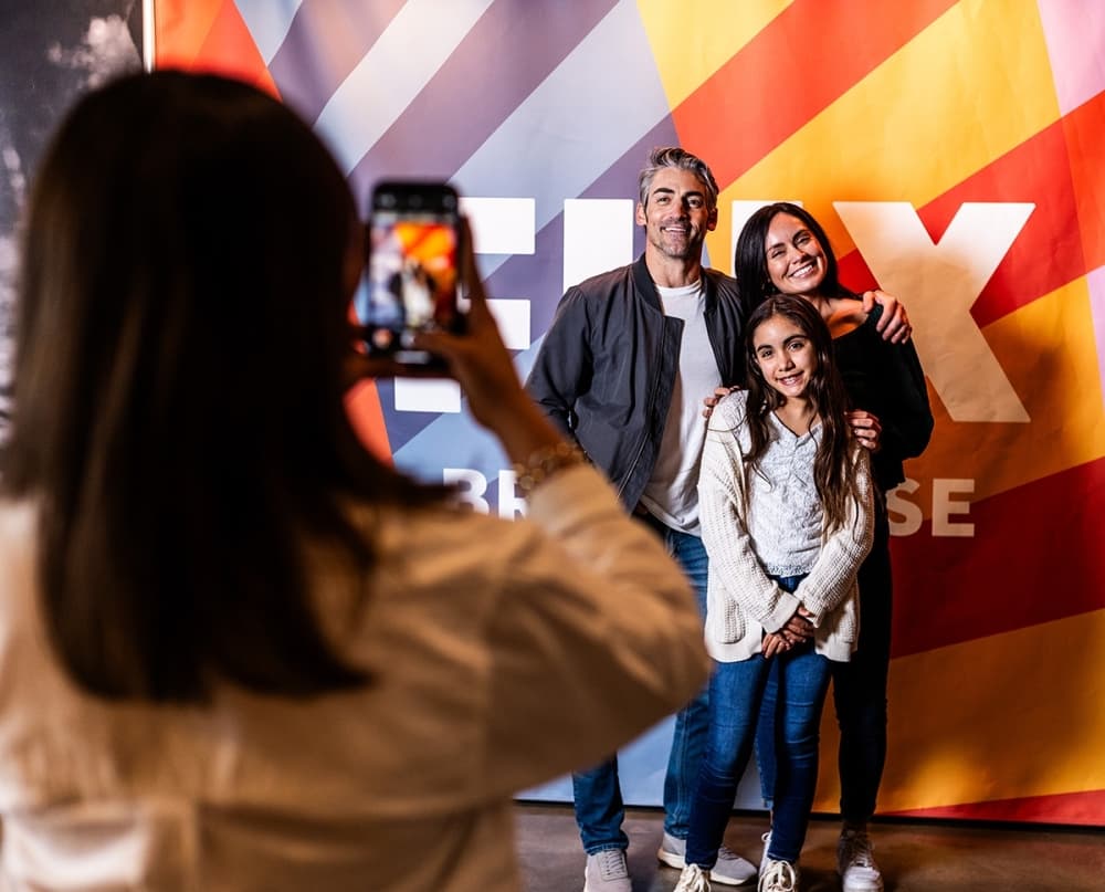 Families watching $5 summer movies during Camp Flix at Flix Brewhouse with kids meals and sensory-friendly screenings in Texas