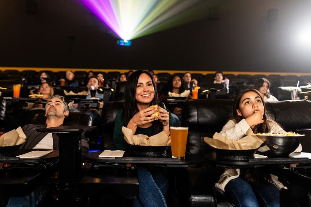 Parents and children attending Camp Flix summer movie program at Flix Brewhouse with $5 tickets and family-friendly entertainment