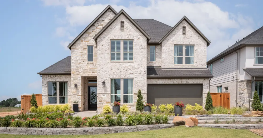 Toll Brothers new construction home in Pecan Ridge featuring spacious front elevation.
