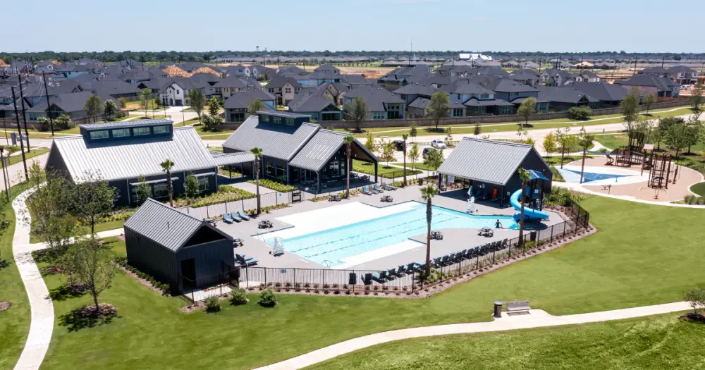 Resort-style swimming pool and waterslide at Pecan Ridge in Fulshear.