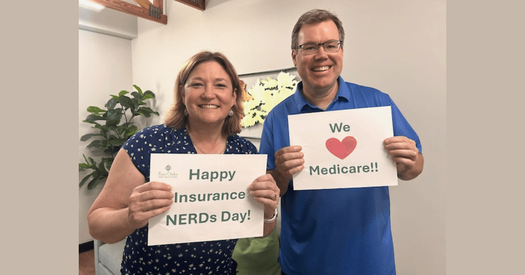 Two people smiling, holding signs reading "Happy Insurance NERDs Day!" and "We love Medicare!!