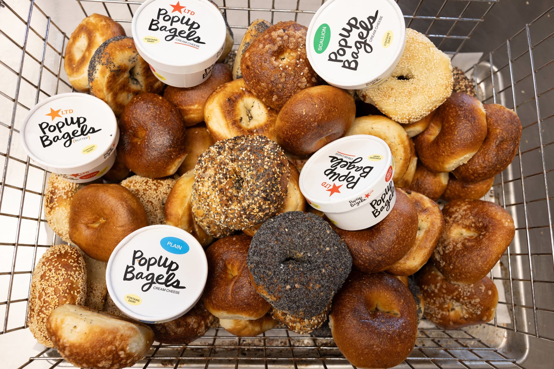 PopUp Bagels serves bagels topped with cream cheese in McKinney