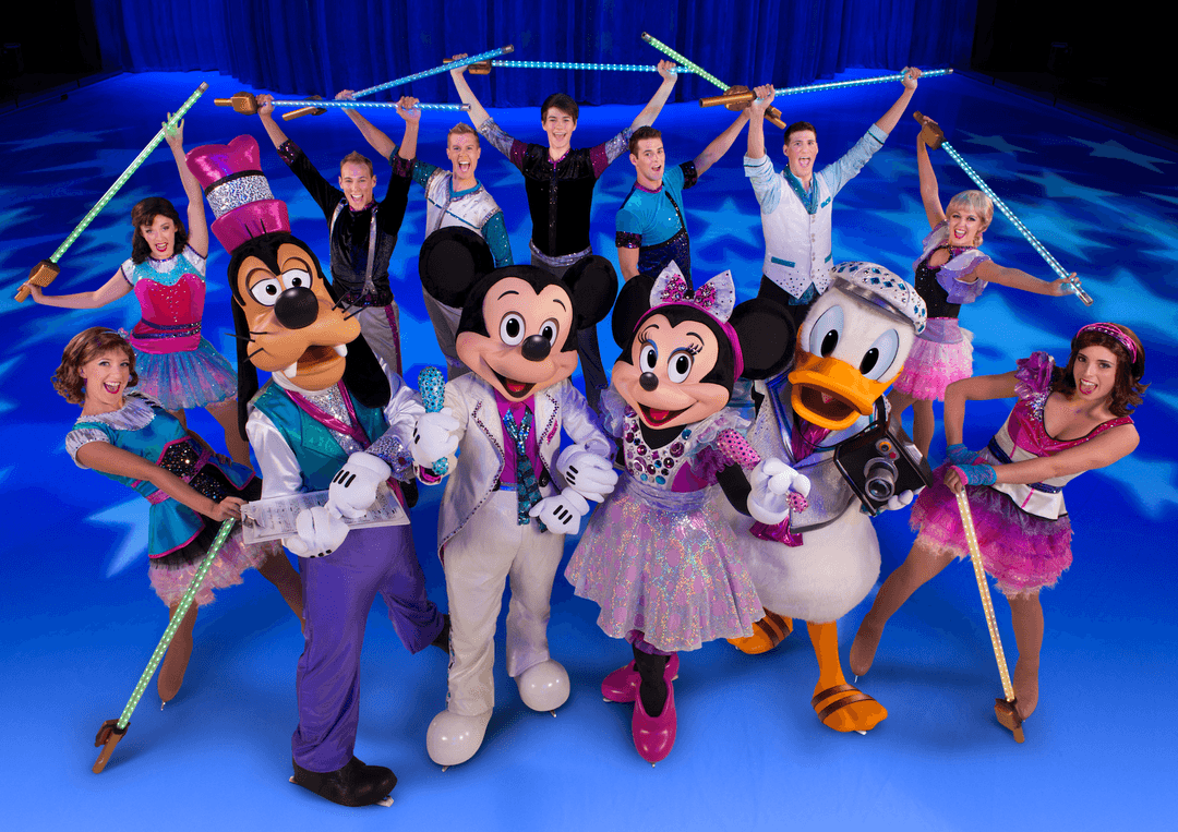 Disney on Ice cast poses with Mickey, Minnie, Goofy and Donald as skaters hold glowing light-up batons on blue ice.