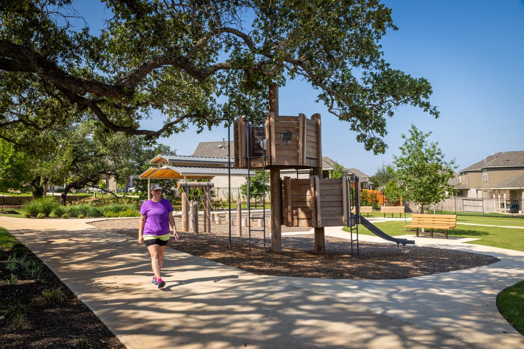 person walking by the playground