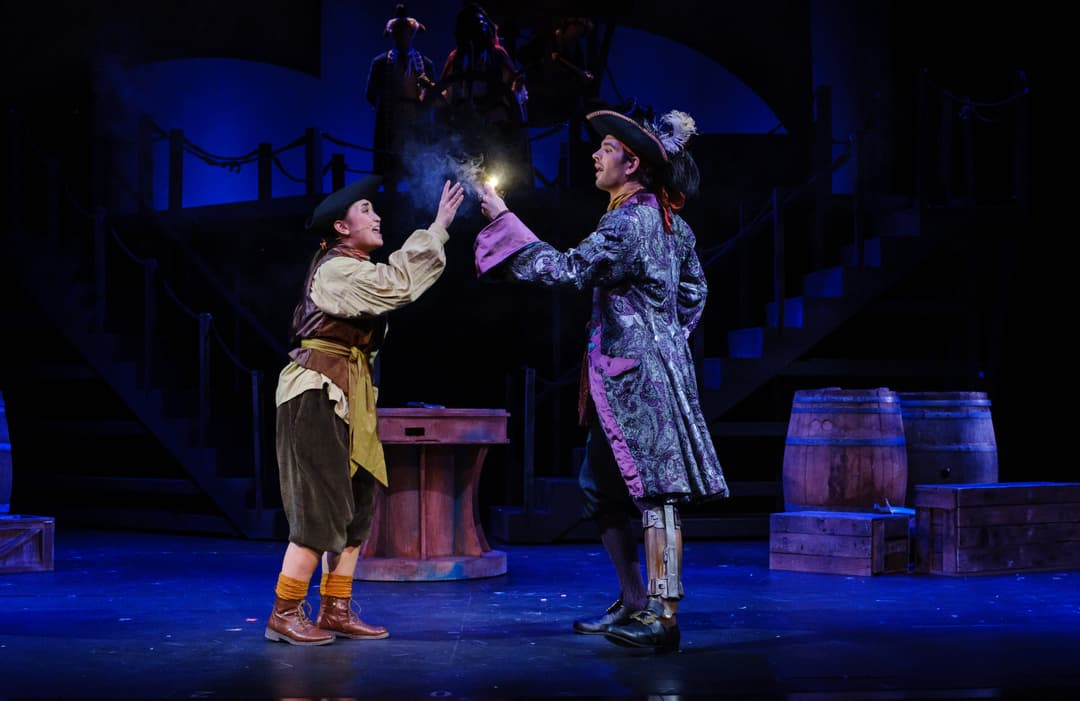 Two actors on stage dressed as pirates