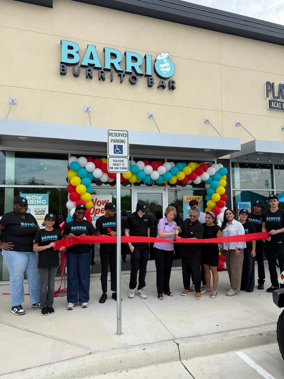 people at a ribbon cutting