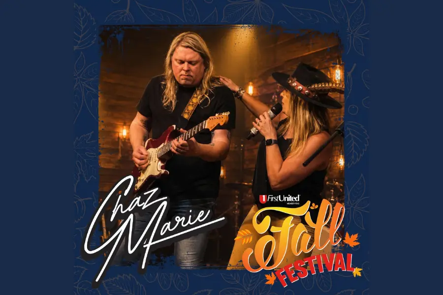 Chaz Marie band performing at First United Fall Festival, guitarist and singer with microphone on stage.