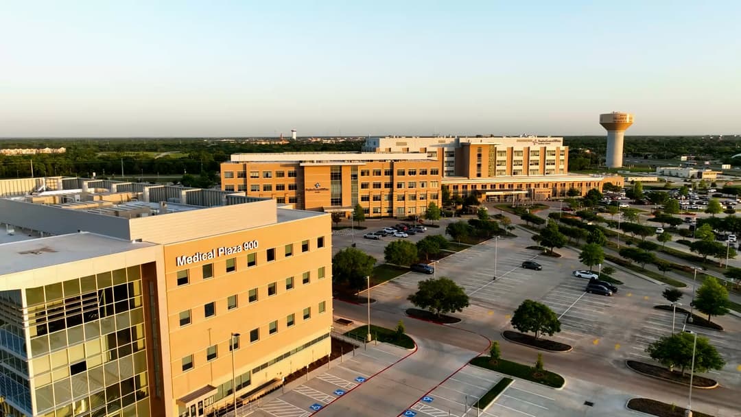 Aerial view of Baylor Scott & White medical campus with Medical Plaza 900 building and College Station water tower.