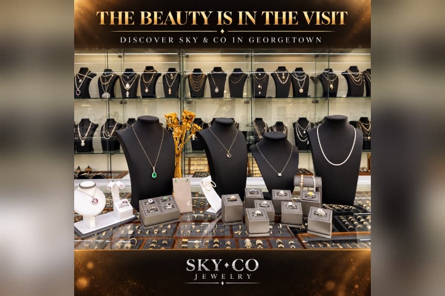 Jewelry store display of necklaces and rings; text reads "The Beauty Is In The Visit, Discover Sky & Co in Georgetown.