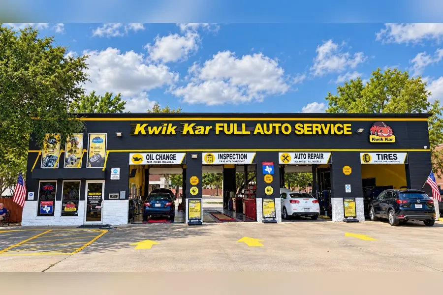 Kwik Kar Full Auto Service building with cars in service bays for oil change, inspection, auto repair, and tires.