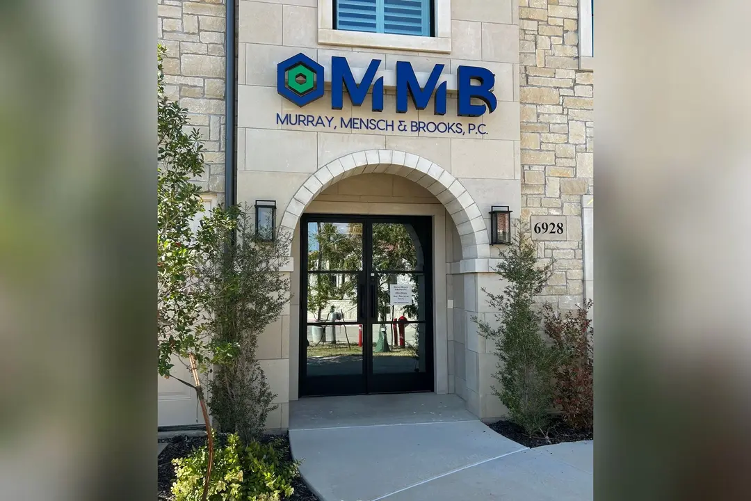 Arched stone entrance of Murray, Mensch & Brooks, P.C. (MMB) office building at address 6928.