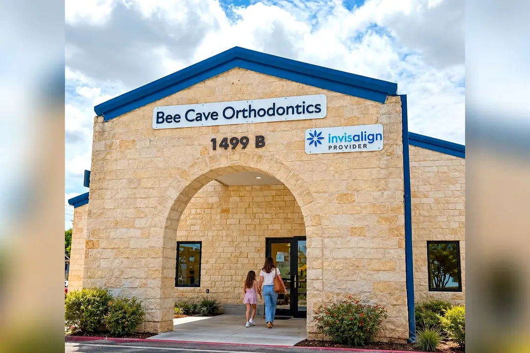 Woman and child walk into Bee Cave Orthodontics, a stone building with an arched entrance and Invisalign Provider sign.