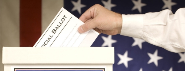 hand placing ballot in ballot box fotolia stock image