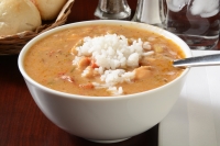 A bowl of chicken and smoked sausage gumbo with white rice