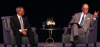 Irving Mayor Rick Stopfer (left) and former WFAA anchor Brad Watson take their seats at the 2020 Irving state-of-the-city event. (Gavin Pugh/Community Impact Newspaper)
