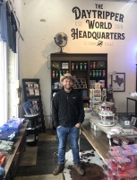Chet Garner stands in the retail storefront of The Daytripper World Headquarters in Georgetown. (Sally Grace Holtgrieve/Community Impact Newspaper)