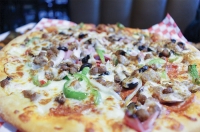 Adriatic Cafe & Italian Grill's menu includes a selection of specialty, gourmet and custom pizzas. (Eva Vigh/Community Impact Newspaper)