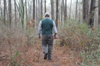 Ed Ponikvar, the vice president of Sam Houston Trails Coalition, walks along the West Side Multi Use Trails. The coalition needs more funds for Hurricane Harvey-related damages as well as trail maintenance. (Eva Vigh/Community Impact Newspaper)