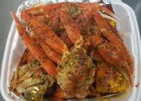 Krab Kingz Seafood's menu includes crab, shrimp, sausage, potatoes, corn and boiled egg, all seasoned in a signature boil. It also offers a garlic butter sauce that comes in five different flavors. (Courtesy Krab Kingz Seafood Cypress)