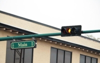 The city of Conroe has begun work to add flashing yellow lights to 26 locations across Conroe to make left turns safer for drivers. (Andy Li/Community Impact Newspaper)