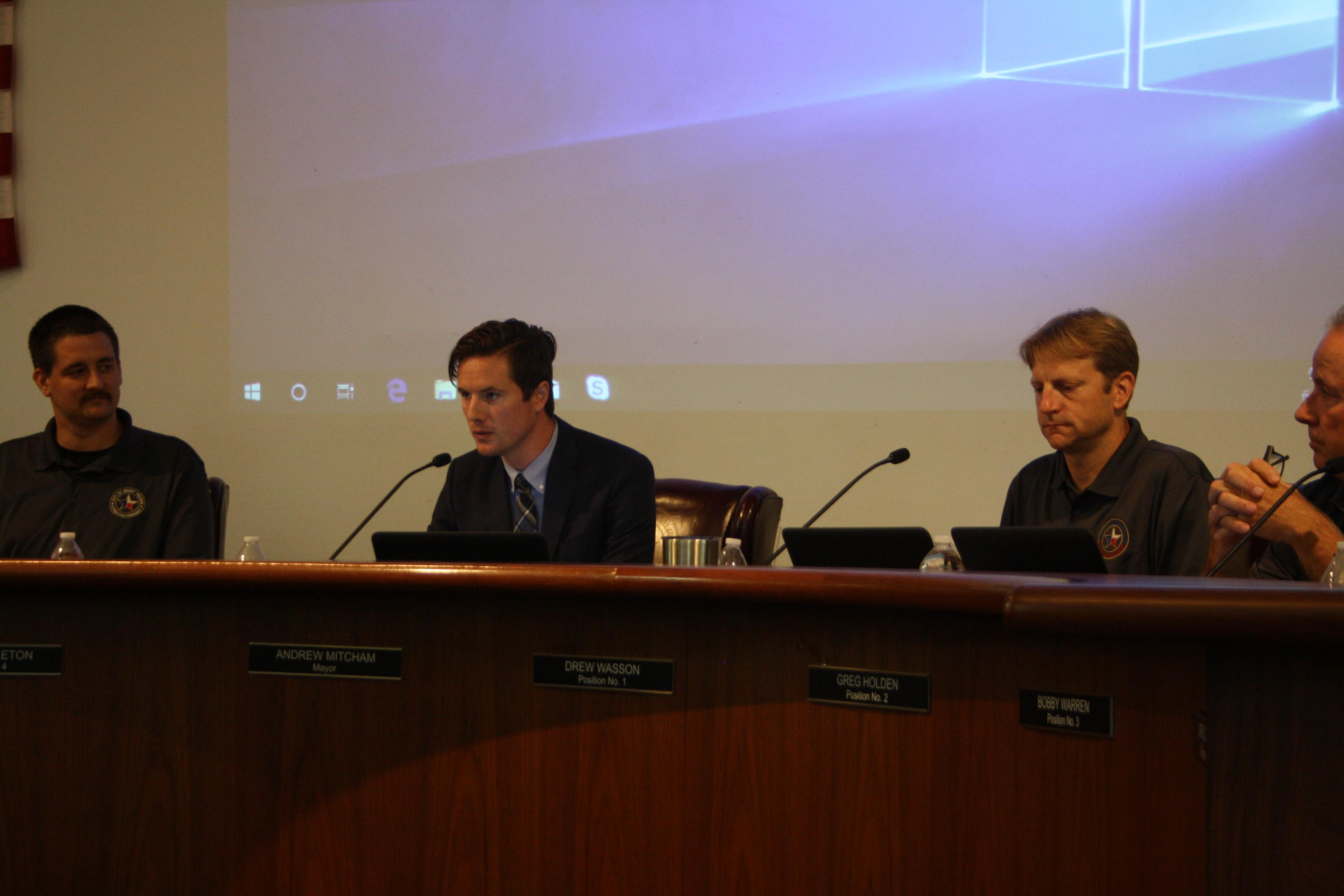 Council Member James Singleton (left) and Drew Wasson (right) are among the three incumbents who will run unopposed to retain their seats in May 2020 elections. Mayor Andrew Mitcham (center) is not up for election until 2021. (Shawn Arrajj/Community Impact Newspaper)