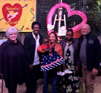 Salimat with her host family, interpreter, mother and the owners of Krause’s after her surgery. (Courtesy HeartGift)