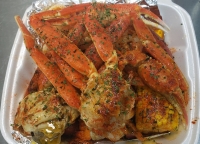 Krab Kingz Seafood's menu includes crab, shrimp, sausage, potatoes, corn and boiled egg, all seasoned in a signature boil. It also offers a garlic butter sauce that comes in five different flavors. (Courtesy Krab Kingz Seafood Cypress)