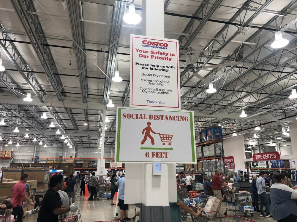 Signage at the Pflugerville Costco illustrates social distancing practices, which the Centers for Disease Control and Prevention recommend to help reduce the spread of COVID-19. (Community Impact Staff)