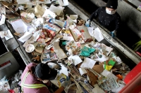 Workers sort through recycled material in Chandler. (Alexa D'Angelo/Community Impact Newspaper)
