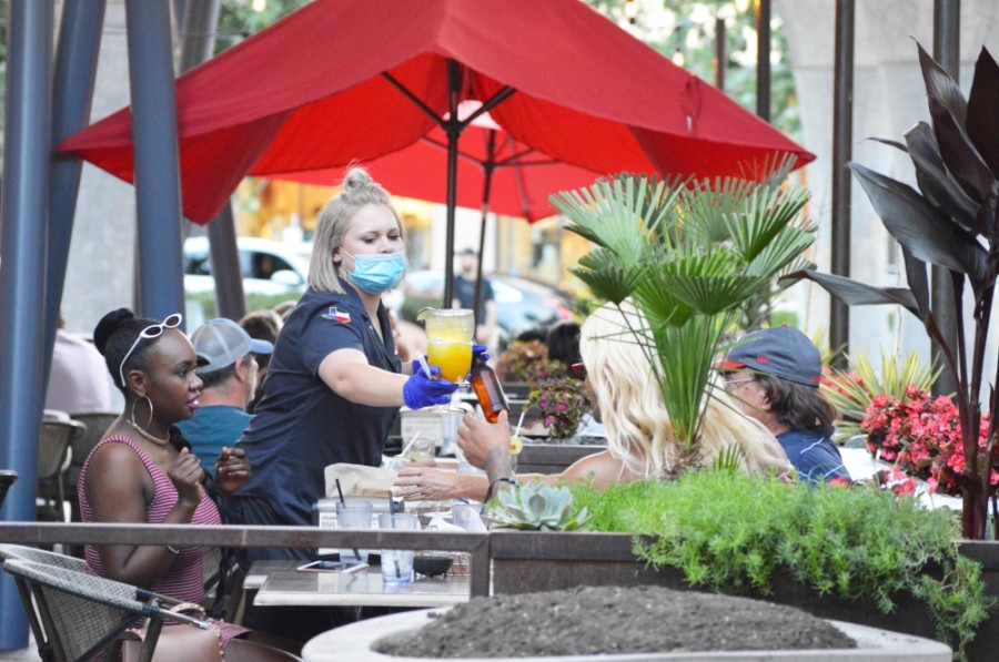 An employee at Cyclone Anaya's Tex-Mex Restaurant serves customers drinks.