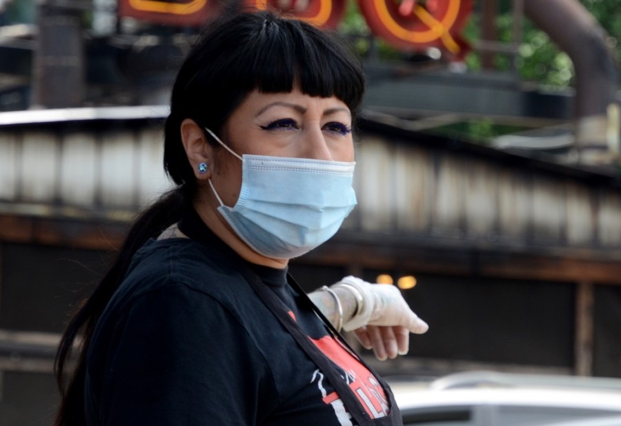 An employee at Terry Black's Barbecue in Austin works in a mask on May 1. (John Cox/Community Impact Newspaper)