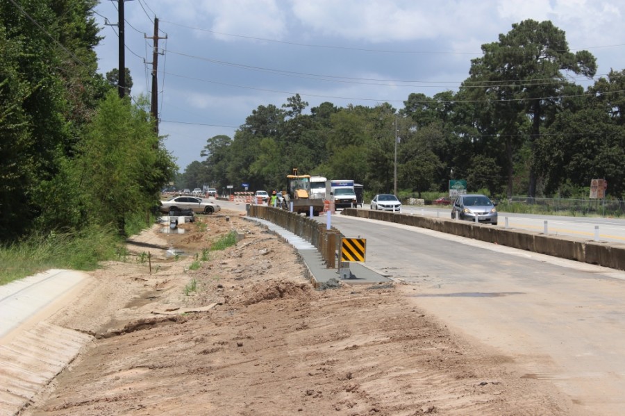 Nearby residents, businesses and commuters will have to endure an extra year of construction along FM 2978, as the four-year widening project will not be completed until 2022, according to mid-July information from the Texas Department of Transportation. (Dylan Sherman/Community Impact Newspaper)