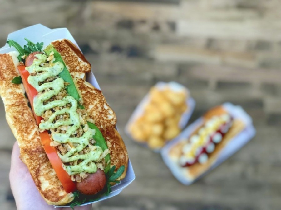 Dog Haus Biergarten specializes in craft hot dogs and will feature a dog-friendly patio, high-definition big-screen televisions and a full bar. (Courtesy Dog Haus Biergarten)
