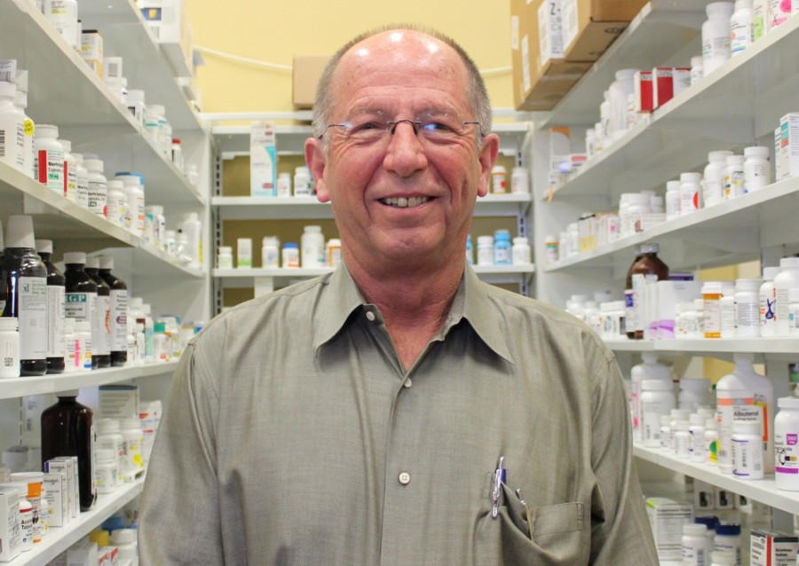 Scott Palmer, owner of Roanoke Pharmacy and Gift Shop, opened his business in 1999 after leaving the corporate world. (Sandra Sadek/Community Impact Newspaper)