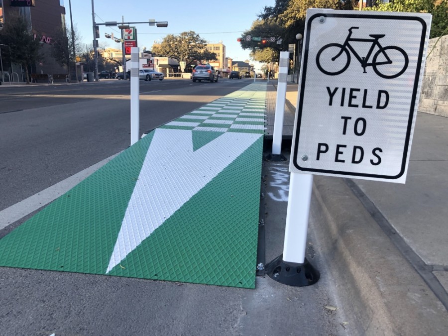 A new bus platform at Dean Keeton Street and Guadalupe Street allows Capital Metro buses to pick up and drop off passengers without pulling out of traffic. (Jack Flagler/Community Impact Newspaper) 