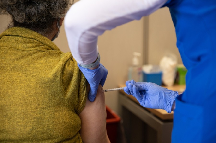 Texas Health Resources nurse Karen Schmidt administers a Pfizer vaccination Plano resident Connie Cordova's arm Feb. 5. (Liesbeth Powers/Community Impact Newspaper)