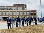 A crew breaking ground on a construction site.