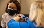 Photo of a woman receiving a vaccine