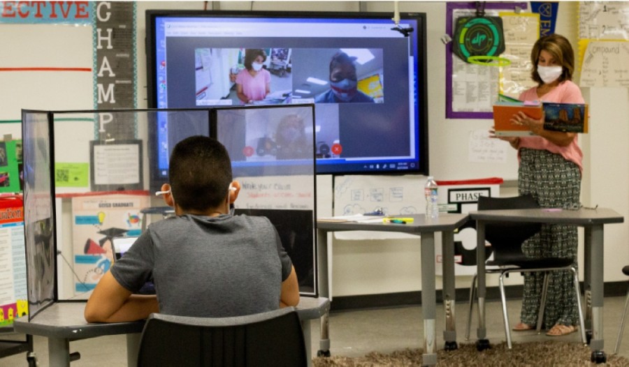 Grapevine-Colleyville ISD teachers, such as Terry Pop at Cross Timbers Middle School, use in-person and virtual instruction methods. (Courtesy of Grapevine-Colleyville ISD)