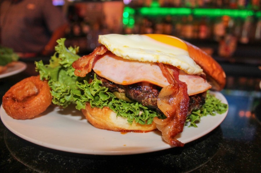 The Everything Burger ($12.99) features a fried egg, chorizo, bacon, ham and several other toppings. (Andy Li/Community Impact Newspaper)