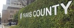 Photo of a sign that says "Travis County"